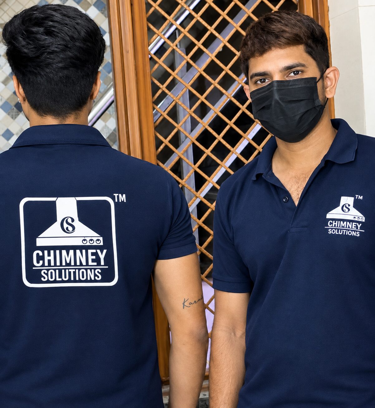Two uniformed Chimney Solutions technicians